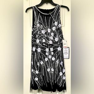 Sequined black and white party dress. Bought for a wedding but never worn.